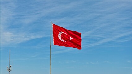 Turkish flag waving in the cloudy sky