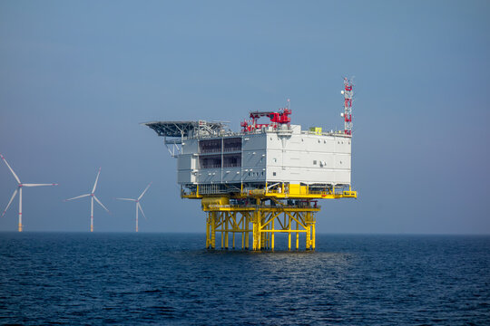 Offshore Wind Farm and Energy Platform in Open Sea. Renewable Energy Infrastructure and Sustainable Power Generation Concept for Environmental and Industrial Use