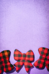 Christmas bow ties, on a purple background.
