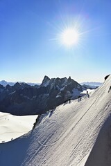 Mountaineers Climb Over Snowcovered Ridge