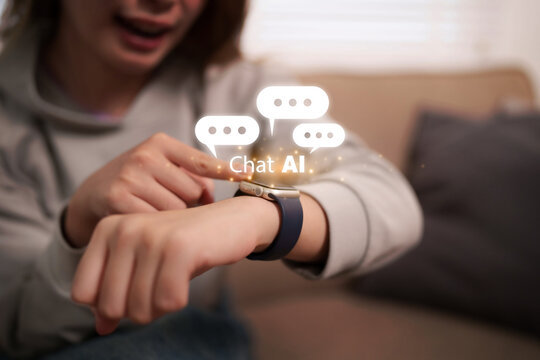 Person interacts with Chat AI on smartwatch device utilizing smart technology for digital communication indoors