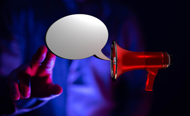 A striking image of a hand interacting with a megaphone and speech bubble. Perfect for conveying announcement, communication, and marketing conc