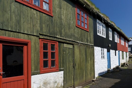 Traditional, whitewashed houses with colour-painted timber cladding and grass-soil roofs, Mykines Island, Faroe Islands, Denmark