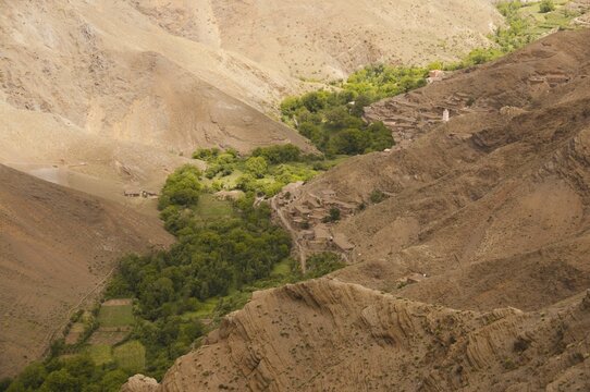 River valley with small fields and village with Berber mud houses, Ait Bouguemez Valley, High Atlas, Morocco