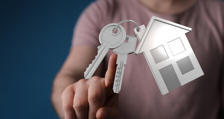 Image of a person's hand holding a house key, representing buying or selling property. Perfect for real estate, home ownership and mortgage rela