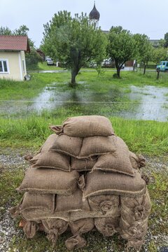Sandbags, continuous rain, high water, flooding, town, houses, Whitsun floods 2013, climate change, Schlehdorf, Alpine foothills, Bavaria, Germany