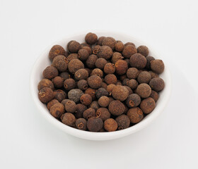 Allspice Berries in White Bowl, Aromatic Spice for Cooking and Flavoring