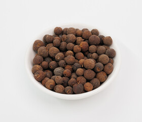 Allspice Berries in White Bowl, Aromatic Spice for Cooking and Flavoring