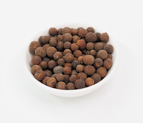 Allspice Berries in White Bowl, Aromatic Spice for Cooking and Flavoring