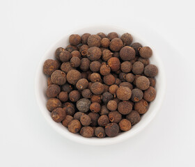 Allspice Berries in White Bowl, Aromatic Spice for Cooking and Flavoring