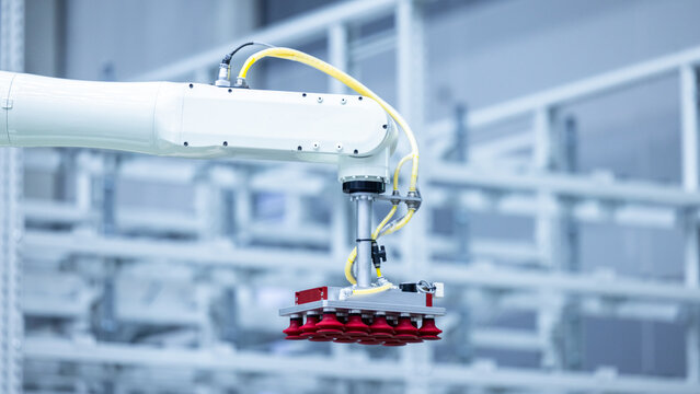 Robotic arm handling boxes on pallets in automated warehouse, Logistics warehouse automation robotics, Robotic arm automated factory packing system efficient industrial box handling and logistics