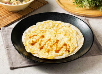 Puff pastry egg pancake , a Taiwanese breakfast delight. Perfect for showcasing Asian cuisine, food blogs, and travel guides. Capture the essence of culinary tourism.