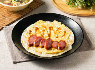 Taiwanese Taiwanese Puff Pastry Sausage Omelette with sausage. Perfect for breakfast, lunch, or a tasty snack. Authentic street food experience, rich culture, and culinary artistry in every bite