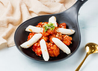 Authentic Korean fried chicken and tteokbokki, a flavorful fusion. Perfect for food bloggers and restaurants, capturing a delicious culinary experience.