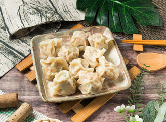 Steamed cabbage dumplings, beautifully arranged for a tempting meal. Perfect for food blogs, restaurant menus, or culinary projects, promising a gourmet experience.