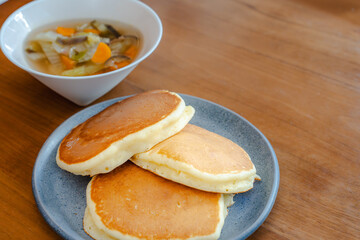 Fluffy pancakes and vegetable soup for breakfast
