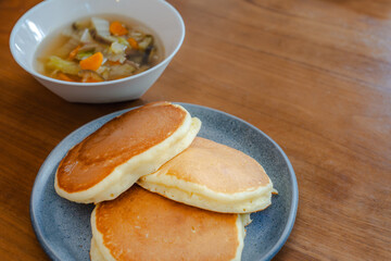 Fluffy pancakes and vegetable soup for breakfast
