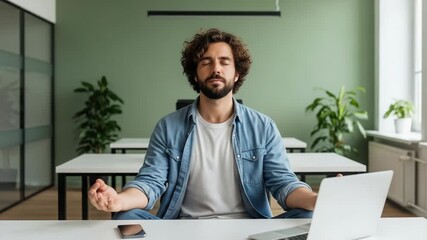 Man meditating in office, practicing mindfulness and stress relief - Powered by Adobe