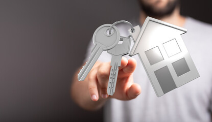 A hand presenting keys and a house symbol, representing home ownership, mortgage, and real estate investment. Ideal for property concepts and ne