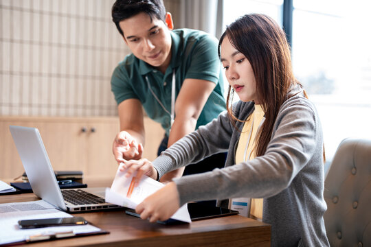 Telemarketing, manager and employee with customer service, call center or conversation with help desk. Business people, man or woman with tech support, crm or advice with mentor, internet or coaching