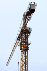 Construction tower crane against the sky.
