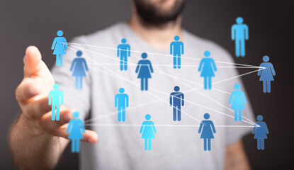 Human hand reaching out with a network of connections symbolizing teamwork, communication, and social interaction in the digital age.