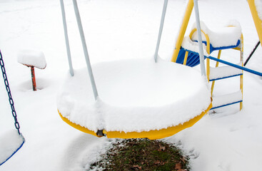 Snow covered play set in Missouri during winter