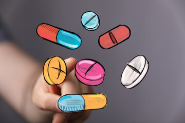 Image of hand interacting with colorful pills and capsules. Perfect for healthcare, medicine, and pharmacy.