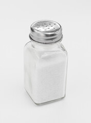 Glass Salt Shaker With Metal Top in Minimalist White Studio Shot for Kitchen and Cooking