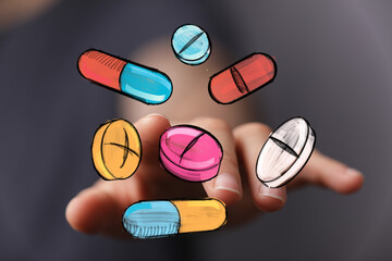 Bright image of hand interacting with colorful pills and capsules. Ideal for healthcare, medicine, pharmacy, and wellness.