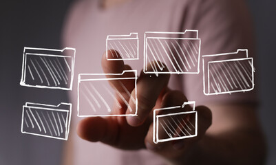 Abstract image of hand interacting with digital files, folders, data organization, cloud storage,...