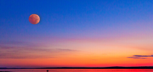 Orange Moon Over and Orange Ocean