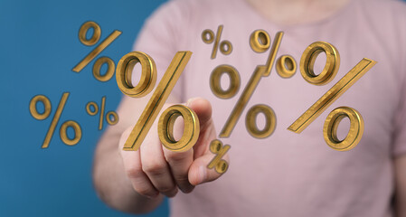 Golden percent symbols floating near a person's finger, symbolising financial concepts like interest rates, discounts, deals, and profits. Busin