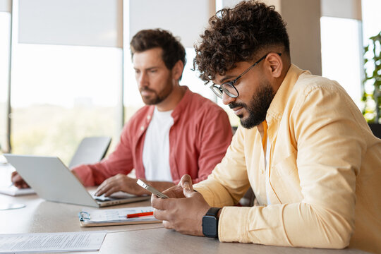 Diverse business men working at office meeting