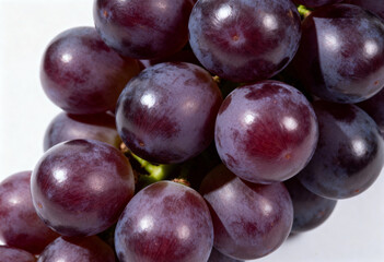 Fresh Purple Grapes on White Background in Close-Up(generated AI)