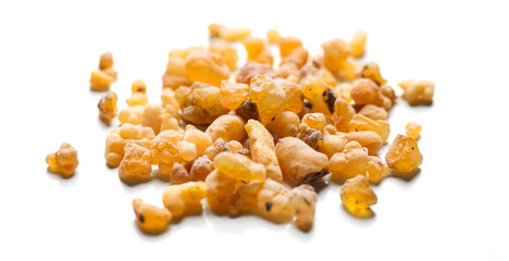 Frankincense olibanum resin, Boswellia sacra Isolated on white background. Frankincense or olibanum aromatic resin used in incense and perfumes, border design, macro shot.  