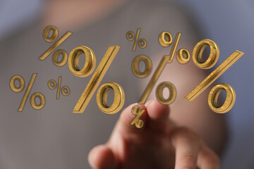 Close up shot of a hand touching floating percent symbols. Ideal for financial, marketing, and...