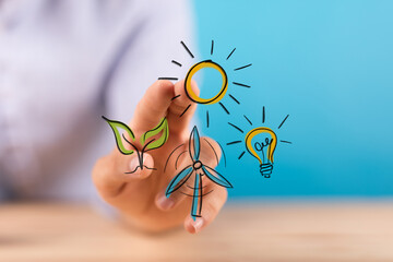 A hand interacts with digital icons representing renewable energy sources like sun, wind, and plant...