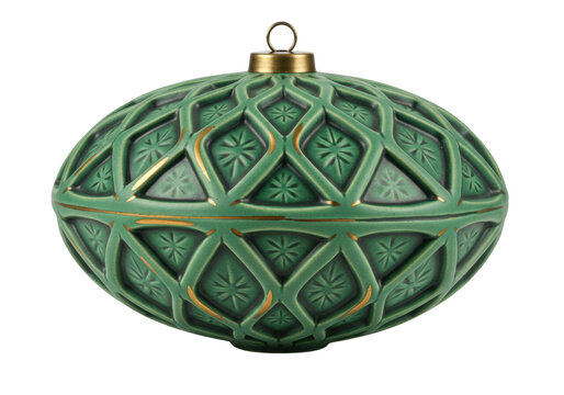 Isolated green ceramic holiday ornament with intricate geometric pattern, golden details
