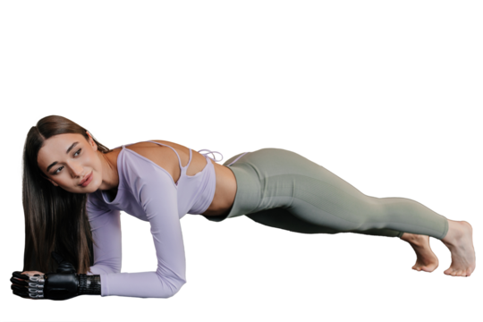 Beautiful brunette caucasian girl in sportswear with bionic hand makes plank exercises on transparent background. Fit Italian female with limb prosthesis at workout.