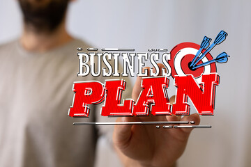 Business plan concept showing a target with darts, symbolizing goals and success in a business...