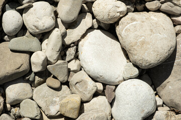 Smooth Natural Stones near Mountain River. Eco Friendly Background with Organic Texture