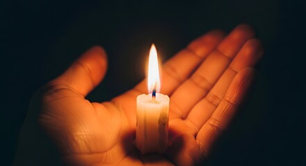 A comforting glow: A lit candle rests safely in open hands in the darkness,A warm, ethereal scene: A candle burns bright in open hands, casting light on the dark