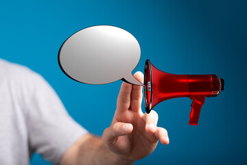 Image of a person using a megaphone with a speech bubble, conveying announcement, communication, and information. Ideal for marketing and advert