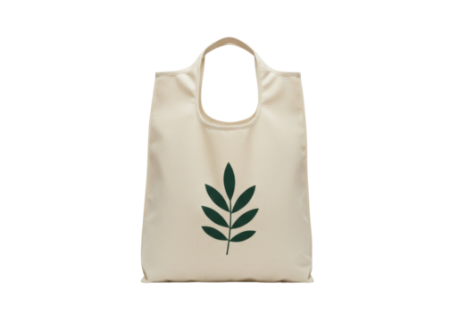 Reusable beige tote bag with green leaf isolated on white, eco-friendly shopping bag for groceries and sustainable lifestyle