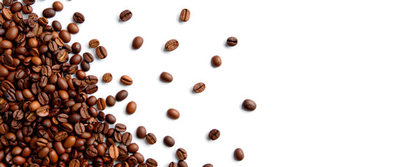Roasted coffee beans in the air on a white background. Coffee and snack concept.. black coffee beans