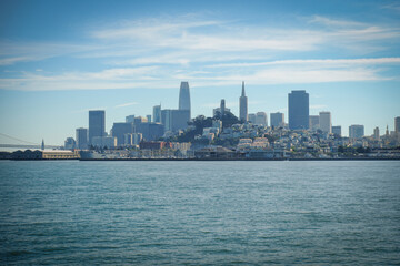 Naklejka premium A view out to the San Francisco Skyline showing the sky scrapers from a boat out in the Bay