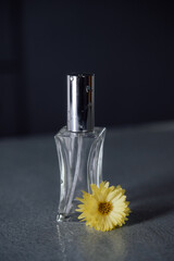 perfume bottle and flower