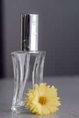 perfume bottle and flower