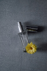 perfume bottle and flower